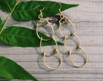 Circular, segmented gold color wire earrings