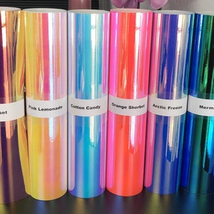 May include: Six rolls of iridescent vinyl in various colors, including sunset, pink lemonade, cotton candy, orange sherbet, arctic freeze, and mermaid.