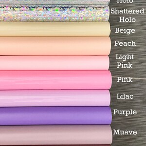 May include: A variety of colors of vinyl sheets, including red, black, white, silver, beige, peach, light pink, pink, lilac, purple, mauve, blush, baby blue, and mint.