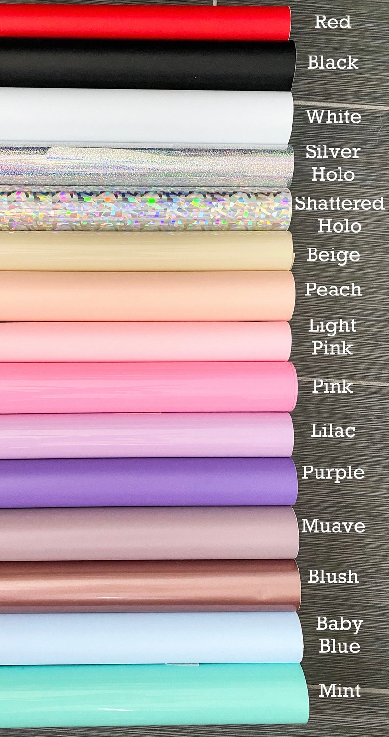 May include: A variety of colors of vinyl sheets, including red, black, white, silver, beige, peach, light pink, pink, lilac, purple, mauve, blush, baby blue, and mint.