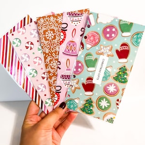 May include: Five Christmas themed planner dividers with different patterns. The dividers feature candy canes, gingerbread, ornaments, and cookies. The dividers are labeled "Christmas Gifts".