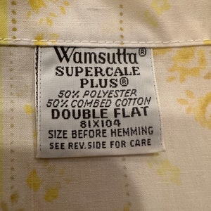 May include: White label with black text that reads "Wamsutta Supercale Plus&reg; 50% Polyester 50% Combed Cotton Double Flat 81x104 Size Before Hemming See Rev. Side For Care"