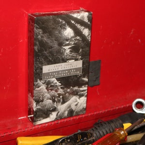 May include: A black and white photo of a forest stream with the text "1996 Jeep Grand Cherokee Tips from the Jeep Product Team" on a white background.