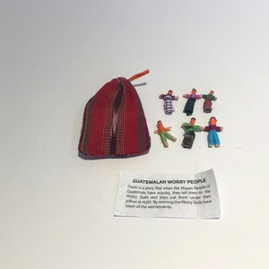 Guatamalan worry dolls in a textile pouch image 1