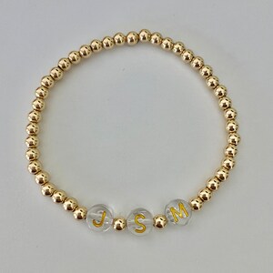 Gold Armband mit klaren/Gold Buchstaben Perlen