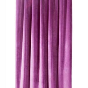 May include: A single panel of deep purple velvet curtains hanging from a silver curtain rod.