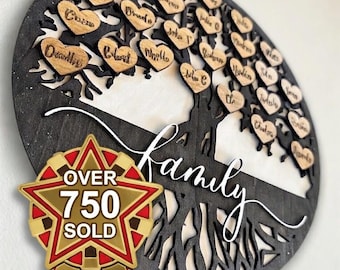 May include: A wooden family tree with heart-shaped name tags. The tree is cut from dark wood, with a white background. The word "Family" is written in cursive. A gold and red star-shaped badge reads "OVER 750 SOLD".