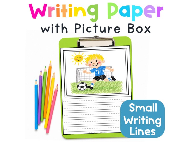 Printable first grade writing paper with a picture box and smaller primary handwriting lines, displayed on a green clipboard with colored pencils.