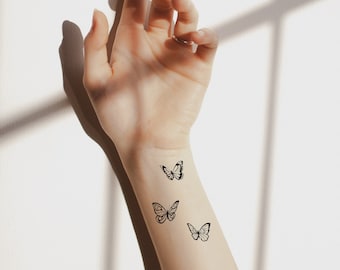 Tatuaje temporal, 16 flores silvestres y mariposas tatuaje temporal realista para mujeres. Diseño original de tatuaje artístico