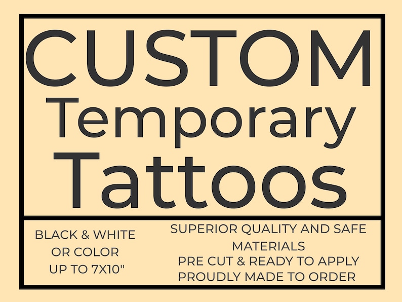 May include: A sign with the text "CUSTOM Temporary Tattoos" in black. The sign also states "BLACK & WHITE OR COLOR UP TO 17.78cm x 25.4cm" and other details about the product.