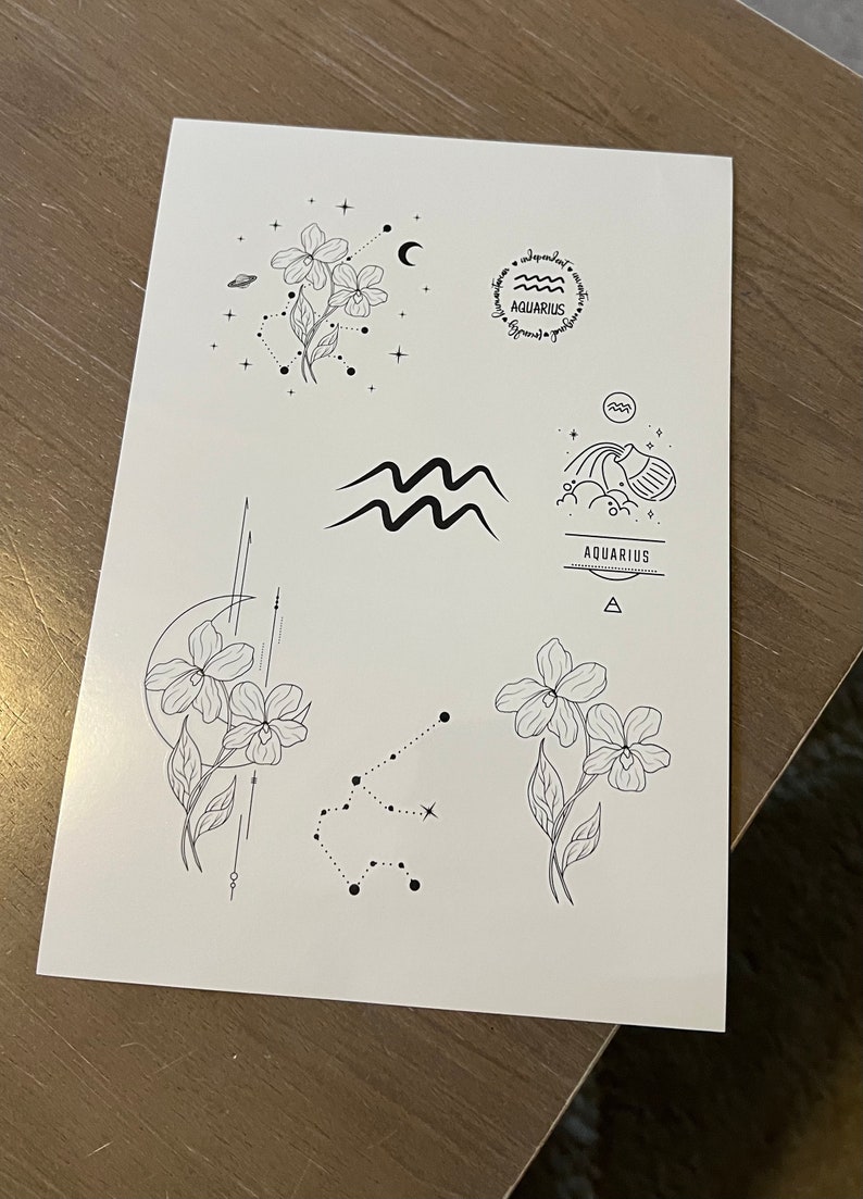 May include: A sheet of paper with five black and white illustrations of the Aquarius zodiac sign. The illustrations include a flower, a constellation, a wave, a water pitcher, and the word "Aquarius" written in a banner.