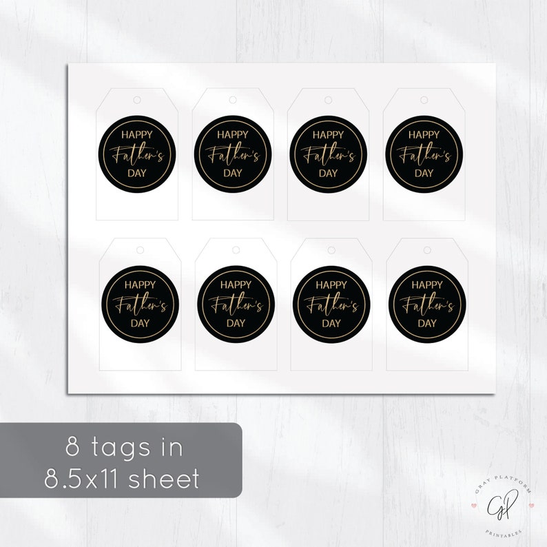 May include: Eight gift tags with a white background. Each tag has a black circle with gold trim and the words "Happy Father's Day" in a script font. The tags are arranged on an 8.5x11 inch sheet.
