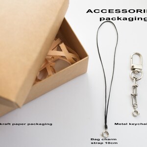 May include: A set of three ceramic mugs with a speckled, matte finish in cream, light grey, and dark grey. Each mug has a simple, minimalist design and a rounded handle.