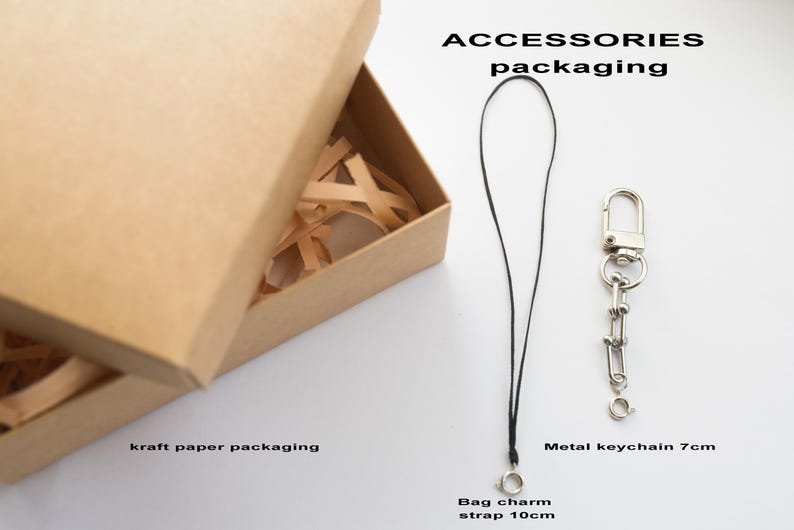 May include: A set of three ceramic mugs with a speckled, matte finish in cream, light grey, and dark grey. Each mug has a simple, minimalist design and a rounded handle.