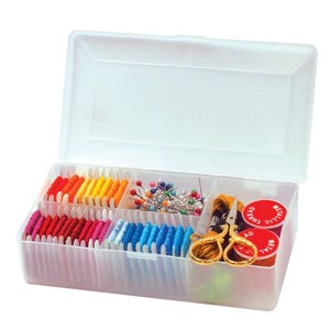 May include: A clear plastic sewing box with a hinged lid, filled with colourful spools of thread, pins, and scissors. The thread colours include red, orange, yellow, pink, and blue. Two red spools of metallic thread are also visible.