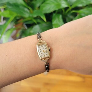 Vintage Elgin Art Deco Dainty Gold Womans Womens Classic Rectangular Cushion Stretch Watch. Approximately 5.8" around, stretchy.  tiny romantic style valentines valentine day gift present romantic vintage shape shaped styles tone gstret  U80