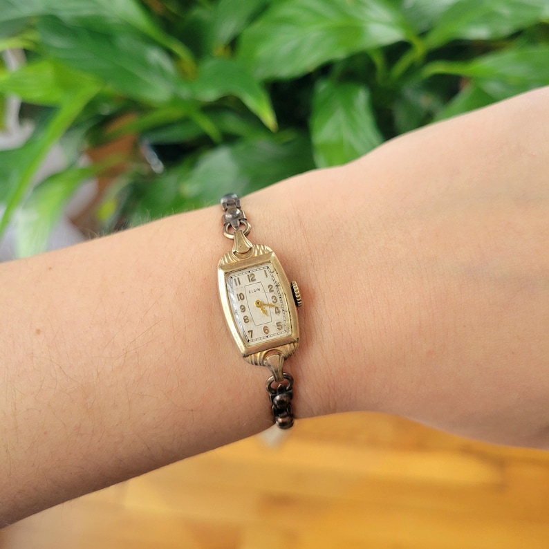 Vintage Elgin Art Deco Dainty Gold Womans Womens Classic Rectangular Cushion Stretch Watch. Approximately 5.8" around, stretchy.  tiny romantic style valentines valentine day gift present romantic vintage shape shaped styles tone gstret  U80
