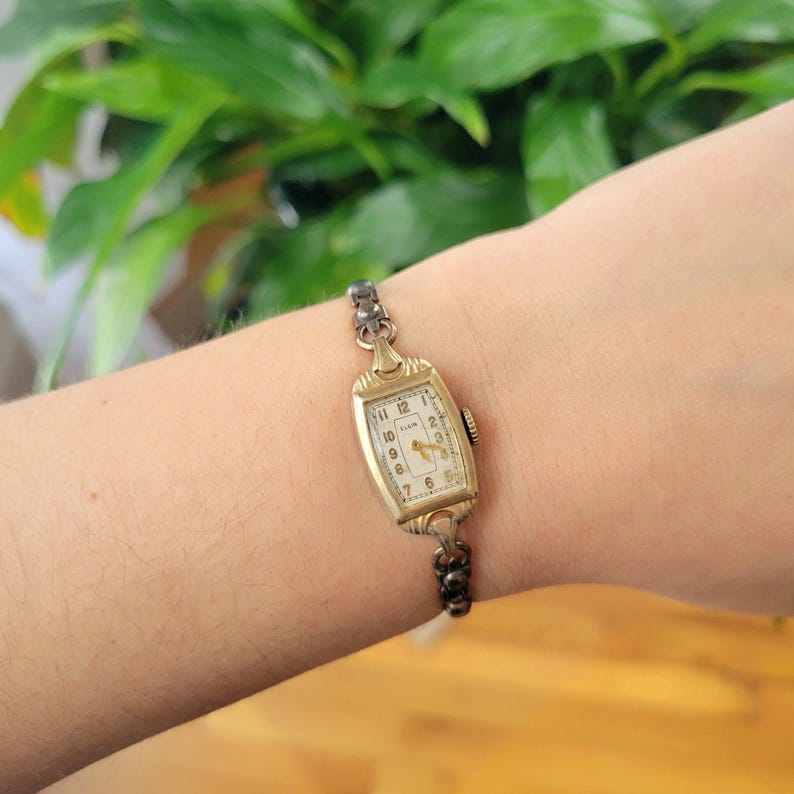 Vintage Elgin Art Deco Dainty Gold Womans Womens Classic Rectangular Cushion Stretch Watch. Approximately 5.8" around, stretchy.  tiny romantic style valentines valentine day gift present romantic vintage shape shaped styles tone gstret  U80
