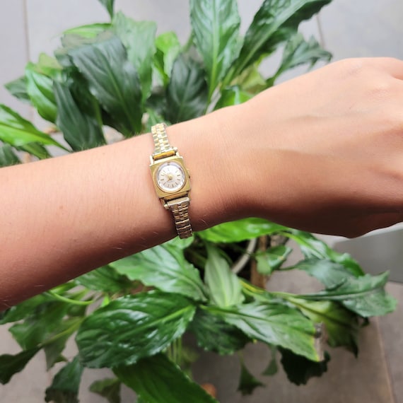 Dainty gold best sale watch