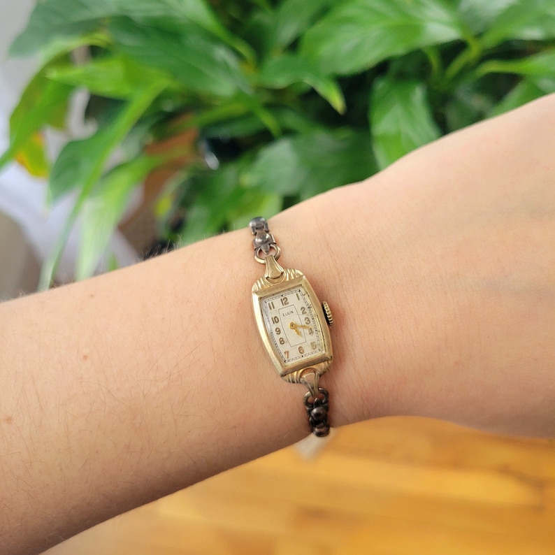 Vintage Elgin Art Deco Dainty Gold Womans Womens Classic Rectangular Cushion Stretch Watch. Approximately 5.8" around, stretchy.  romantic style valentines valentine day gift present romantic vintage shape shaped styles tone gstret  U80