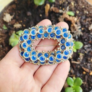 Broche de solapa vintage con piedra preciosa azul plateada