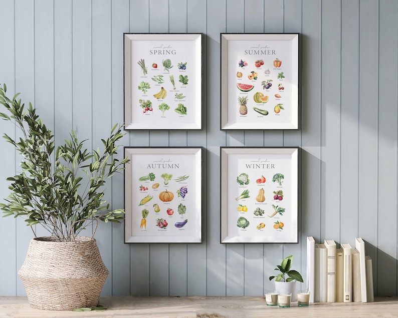 May include: Four framed prints with illustrations of seasonal produce. Each print features the word "Spring", "Summer", "Autumn", or "Winter" at the top and a grid of fruits and vegetables.
