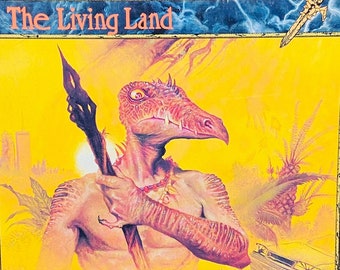 May include: A book cover for a role-playing game called "ZARA: The Living Land". The cover features a yellow background with a humanoid creature with a long beak and a spear. The text "The Sourcebook of Primitive Reality" is at the bottom of the cover.