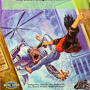 May include: A book cover with a black background and a colorful illustration of a person falling from a futuristic elevator. The title of the book is "Elevator to the Netherworld: The Inner Kingdom Sourcebook" and the book is published by Atlas Games.