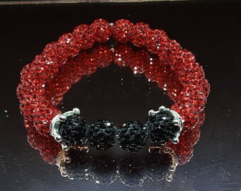 Handmade light siam red and black stretch beaded bracelet with silver spacers this is a very unique bracelet