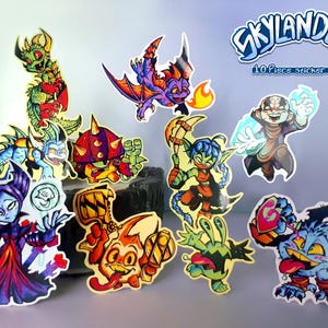 May include: A collection of ten colourful Skylanders character stickers. The stickers depict various fantasy creatures in vibrant colours, with the Skylanders logo and text "10 Piece sticker set!" in the upper right corner.