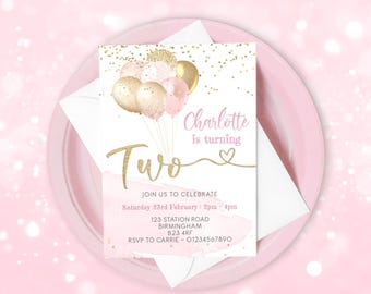 May include: Pink and gold birthday invitation with a watercolor background and gold glitter confetti. The invitation says "Charlotte is turning Two" and includes details for the party, including the date, time, address, and RSVP information.