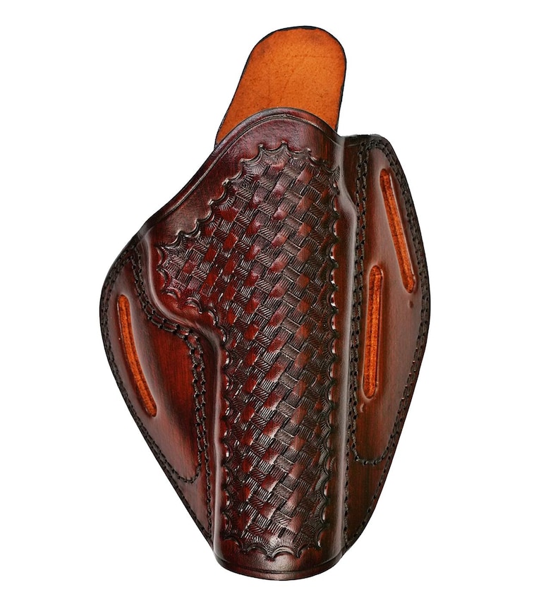 May include: A brown leather holster with a woven pattern. The holster has a flap on the top and a belt loop on the back.