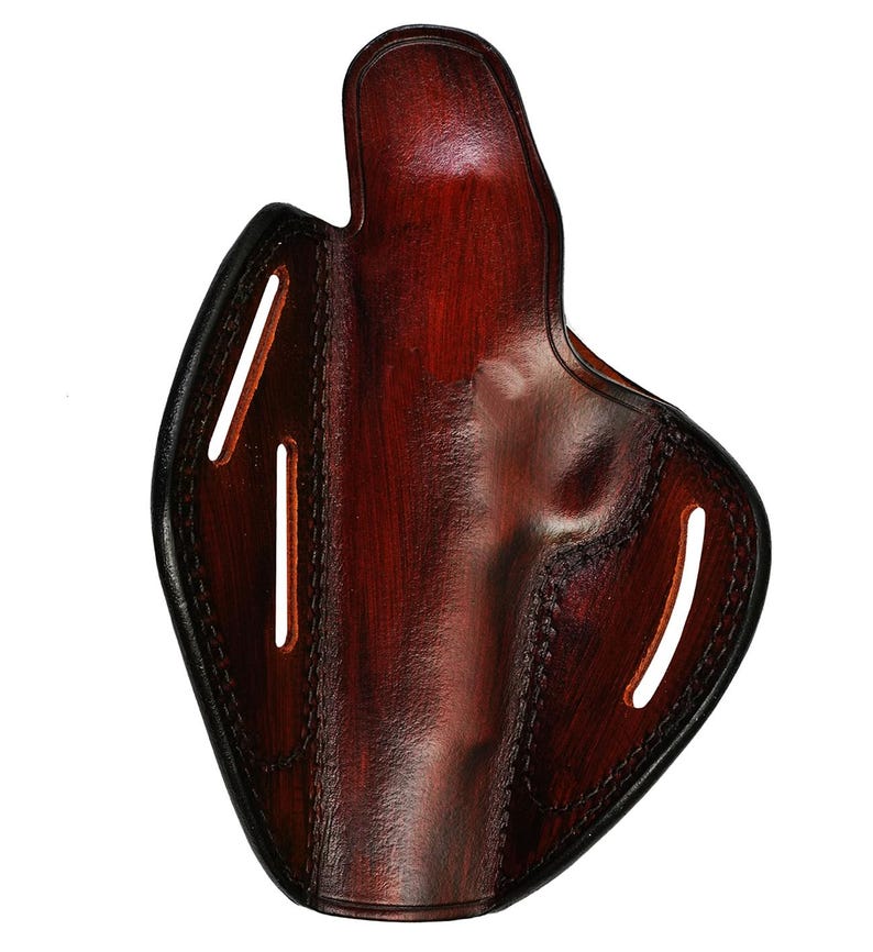 May include: A brown leather holster with stitching detail and cutouts for belt loops.