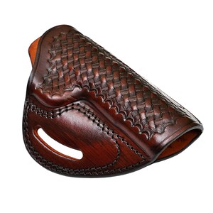 May include: A brown leather holster with a woven pattern. The holster has a stitched edge and a cut-out for a belt.