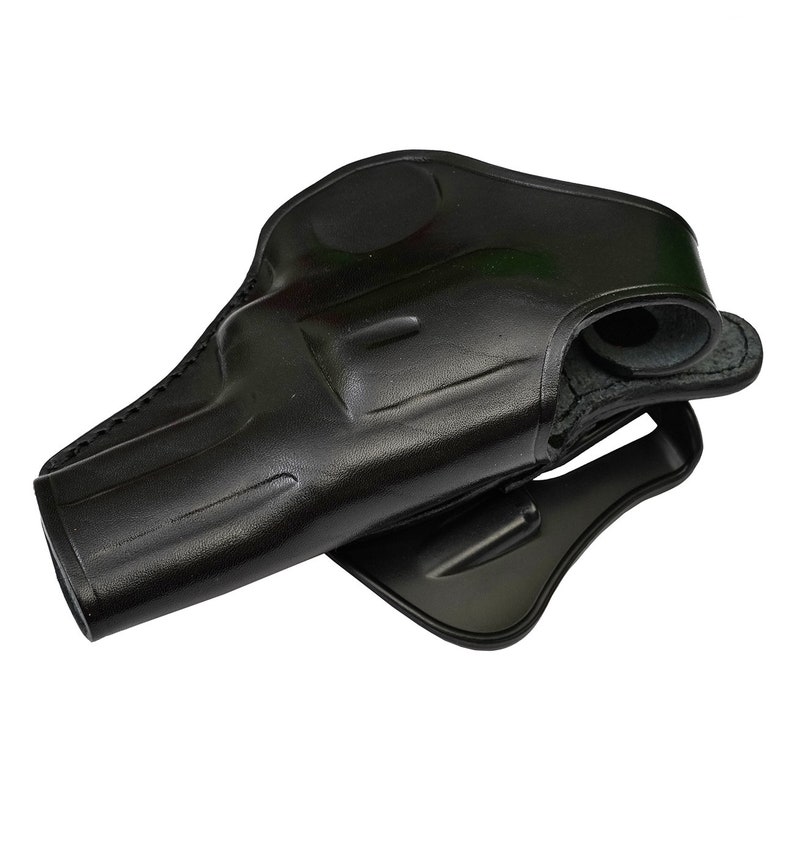 May include: A black leather holster for a handgun. The holster has a belt loop and a snap closure.