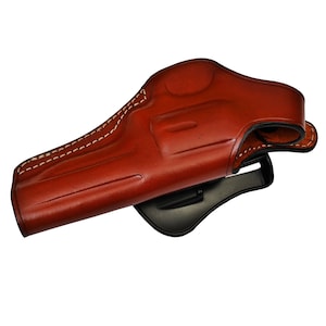 May include: A brown leather holster for a handgun. The holster has a belt loop and a snap closure.
