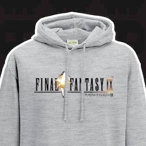 May include: A grey hooded sweatshirt with a front pocket and a drawstring. The front displays the text "FINAL FANTASY IX" in black and gold, with Japanese text below. A star graphic is between the words.