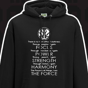 May include: Black hooded sweatshirt with a white graphic print that reads "There is no light without darkness. Through passion I gain FOCUS. Through knowledge I gain POWER. Through serenity I gain STRENGTH. Through victory I gain HARMONY. The Force is all things, I am THE FORCE."