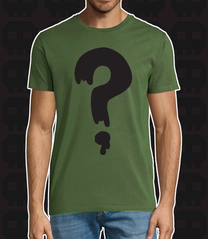 May include: A green t-shirt featuring a black question mark graphic. The question mark is dripping, giving it a spooky, mysterious look.