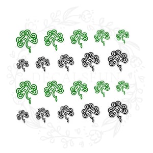 May include: A set of 18 green and black shamrock decals. The shamrocks are in a Celtic knot design.