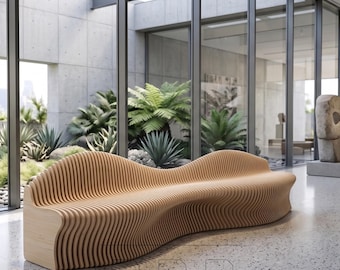 May include: A light brown wooden bench with a wavy design. The bench is made of vertical wooden slats and has a curved shape. The bench is in a modern, open-air space with large windows and greenery.