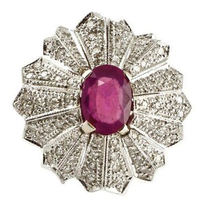 May include: A silver ring with a large oval ruby surrounded by smaller diamonds in a flower-shaped setting.