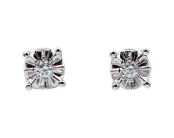 Pendientes de botón con diamantes blancos y oro blanco de 18 quilates.