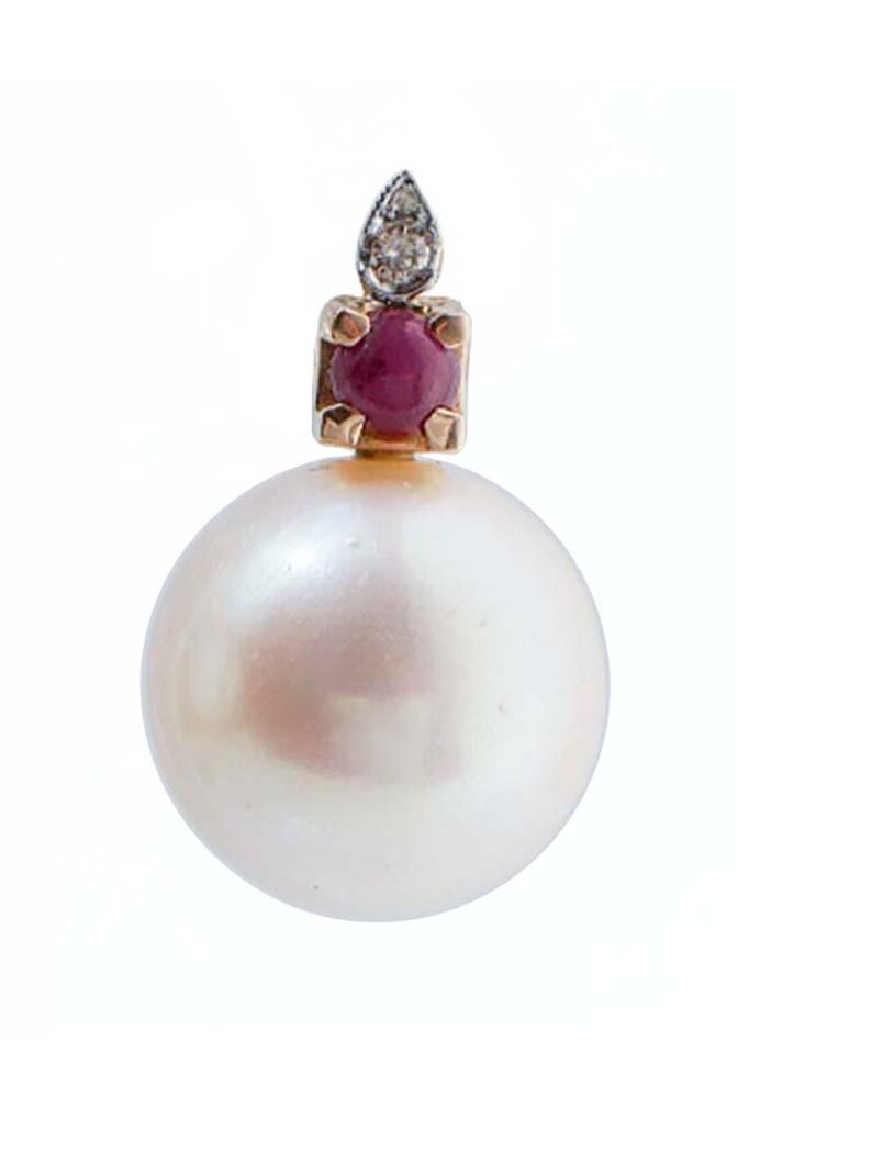 May include: A single pearl earring with a gold setting. The earring features a large, round, white pearl. Above the pearl is a square gold setting with a red gemstone, topped with a small diamond accent. The background is white.