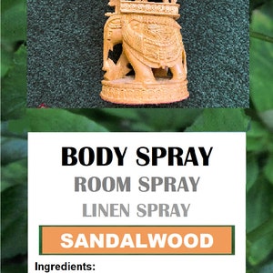 May include: A wooden elephant figurine with a decorative canopy, labeled "Roshy's Herbals". The product is a sandalwood body, room, and linen spray. The label states "100% Natural" and "For external use only". The product is made in the USA and comes in an 8 oz bottle.