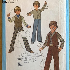 May include: Simplicity sewing pattern number 8705 for children's clothing. The pattern includes instructions for making two sizes of pants, a shirt, and a vest. The pattern is illustrated with three boys wearing the clothing.
