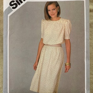 May include: Simplicity sewing pattern number 6240, Beginner's Choice level 3, for a dress with a floral print. The pattern is for size 16, Miss.