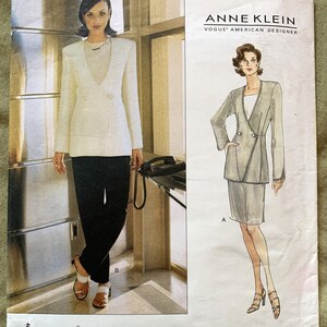 May include: A sewing pattern for a blazer and skirt by Anne Klein, Vogue American Designer. The pattern number is 1810 and the sizes are 8, 10, and 12.