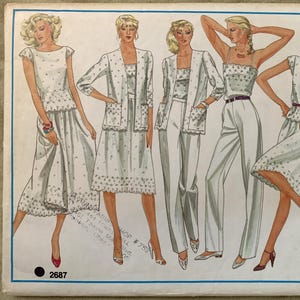 May include: A vintage sewing pattern featuring five different styles of women's clothing. The pattern is for a white top and skirt with lace trim. The pattern number is 2687.