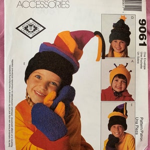 May include: A sewing pattern for a hat and mittens. The pattern includes instructions for making a colorful hat with a pointed top and a pair of mittens with a blue and orange color scheme. The pattern is from McCall's Fashion Accessories and is labeled 9061.